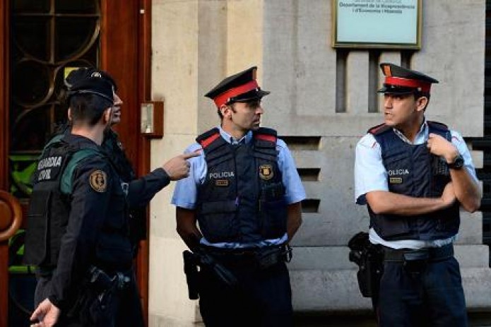 Spain takes control of Catalan police