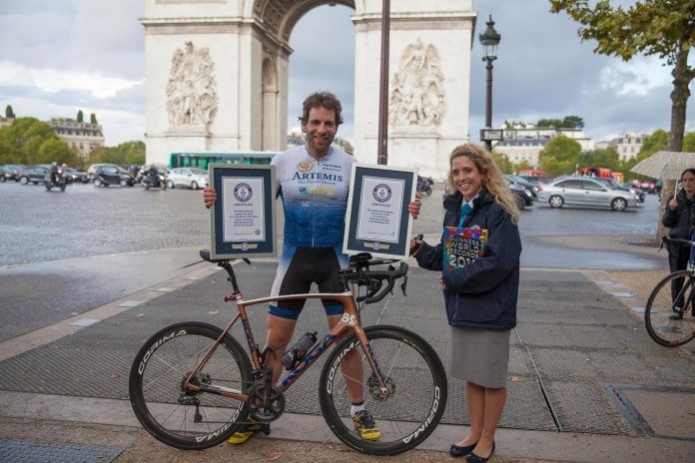 British cyclist smashes world record for circling the world