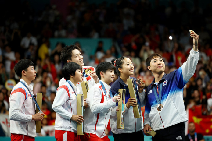 KXDR sportchilari Olimpiada o‘yinlari paytida janubiy koreyaliklar bilan suratda tabassum qilgani uchun jazolanishi mumkin