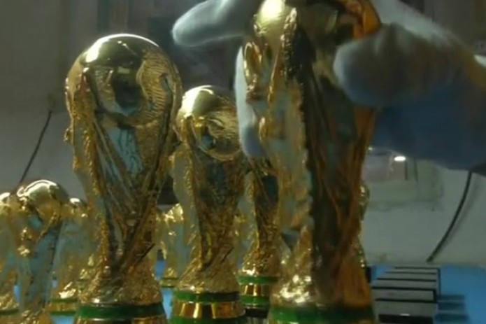 Chinese factory churns out World Cup trophies for soccer fans