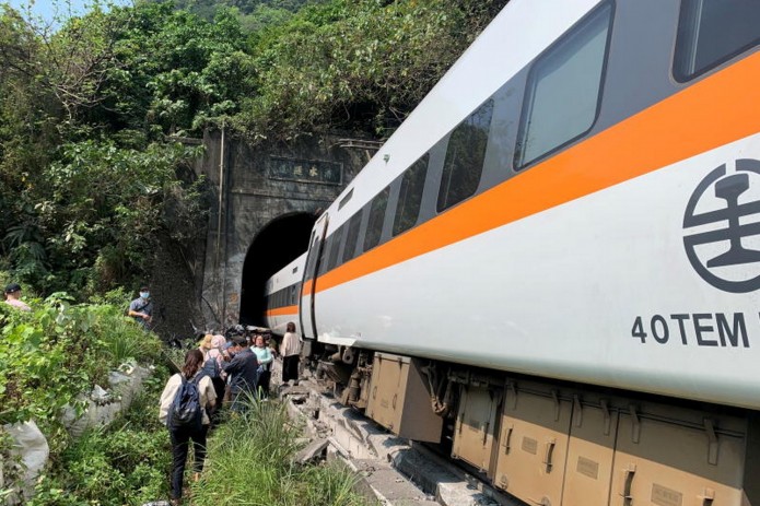 Rescuers recover bodies from train wreck as death toll rises to 48