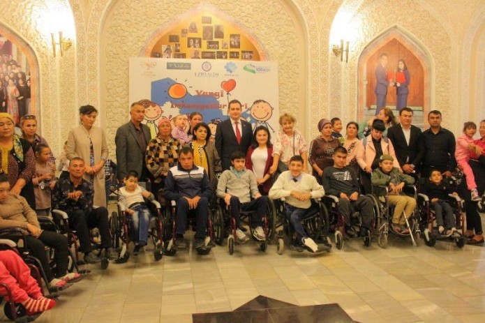 Children with disabilities receive 100 wheelchairs as part of charity campaign