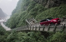Daring racer drives up stairs to Heaven's Gate in China